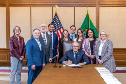 Governor Inslee, State Auditor Pat McCarthy and other supporters pose for signing of HB1179.